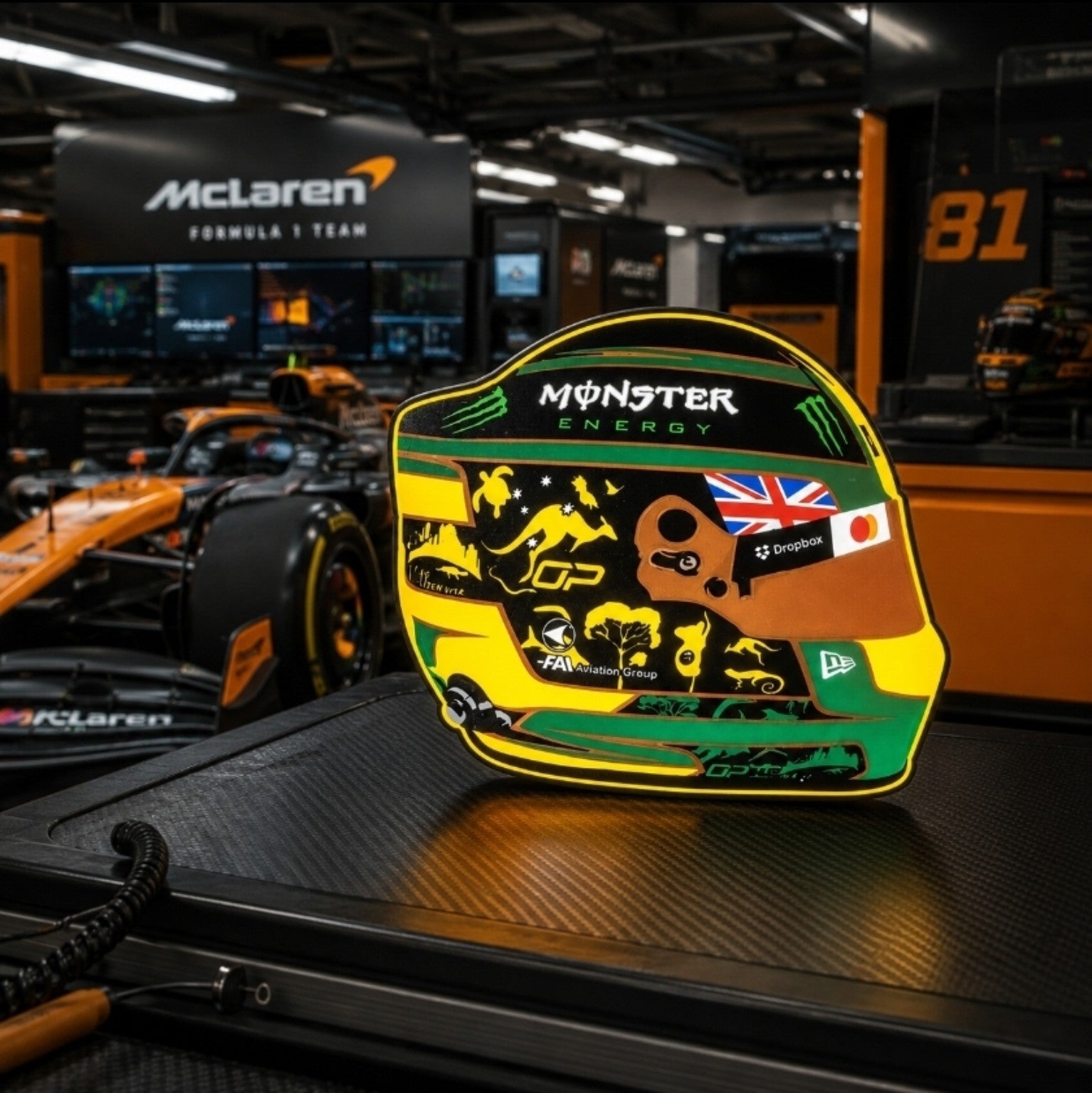 Oscar Piastri Melbourne special helmet LED light box in a McLaren Formula One garage-style setting