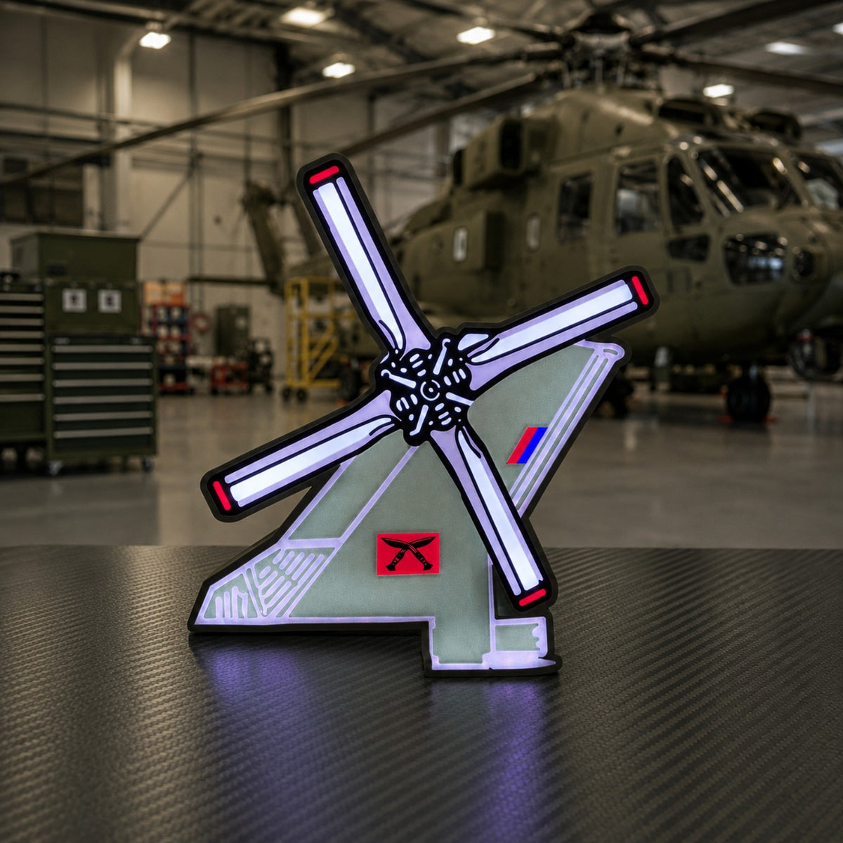 28 Squadron RAF Merlin helicopter LED light box illuminated in a military hangar