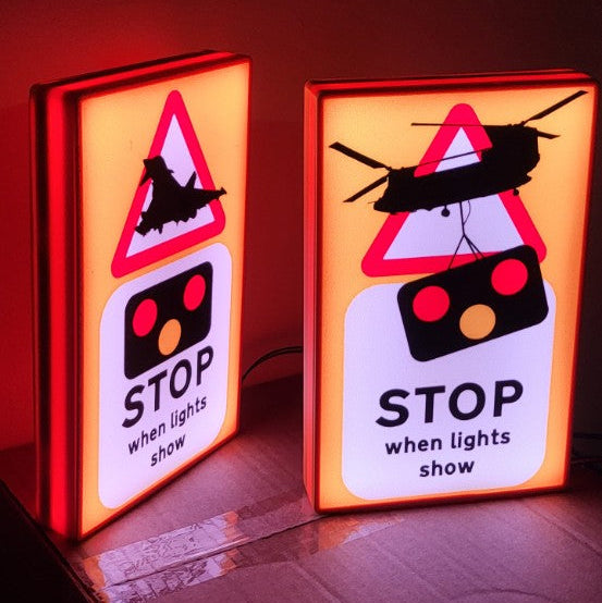 Angled view of illuminated Stop When Lights Show Typhoon and Chinook light boxes